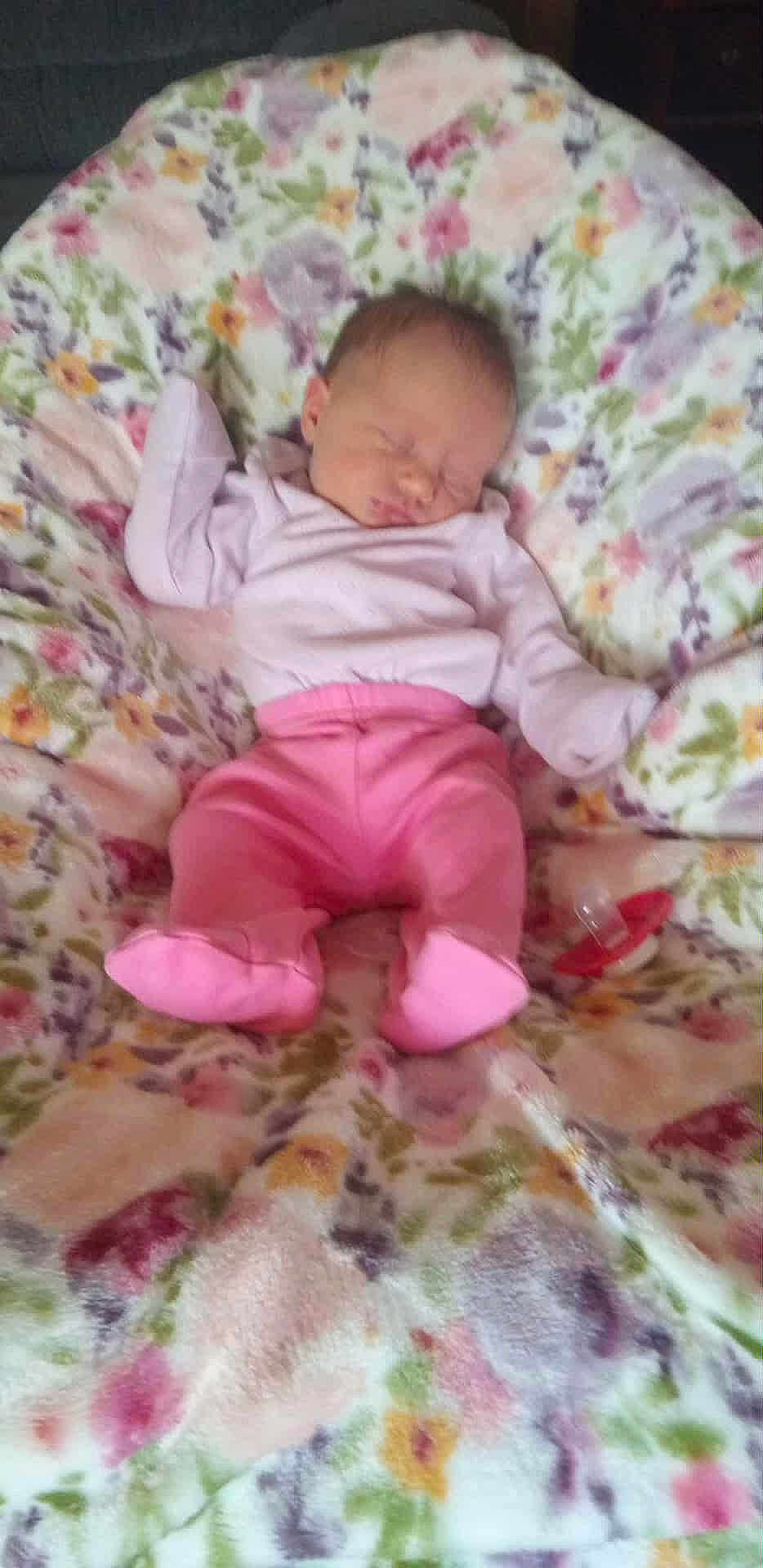 Leah Paige Henry joined the competition — help win amazing prizes! baby, sleeping, pink_pants, light_top, floral_blanket, pacifier, infant, resting, cute, child, soft, cozy, indoors, peaceful, newborn, blanket, clothing, person, portrait, relaxation