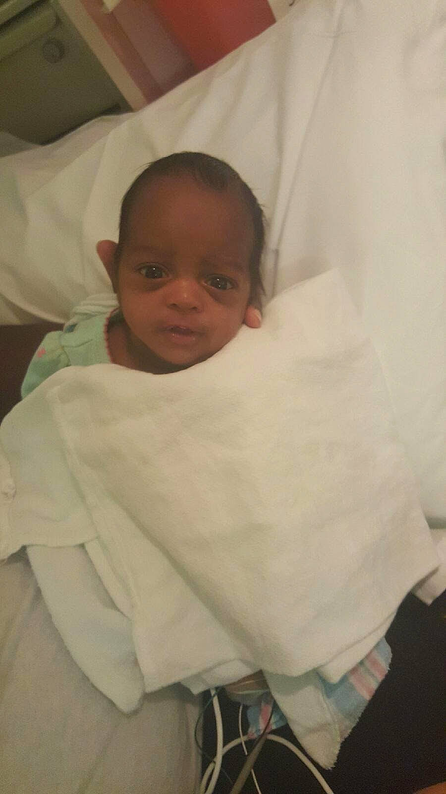 Angelina is registered to the contest to win money with this photo: baby, baby_products, baby_toddler_clothing, bedding, cheek, chest, child, chin, comfort, eyebrow, facial_expression, hairstyle, linens, lip, neck, person, room, skin, sleeve, textile