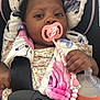 Elizabeth joined the competition — help win amazing prizes! baby, blanket, bottle, car_seat, child, comfort, curious, cute, face, floral_clothing, hand, holding, indoor, infant, pacifier, person, pink, portrait, seatbelt, soft