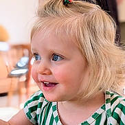 Bonnie participe au concours pour gagner de l'argent avec cette photo : toddler, child, blonde_hair, blue_eyes, hair_clip, striped_shirt, smile, indoor, portrait, happy, cute, face, young_child, person, closeup, baby, clothing, hair, expression, background_blur
