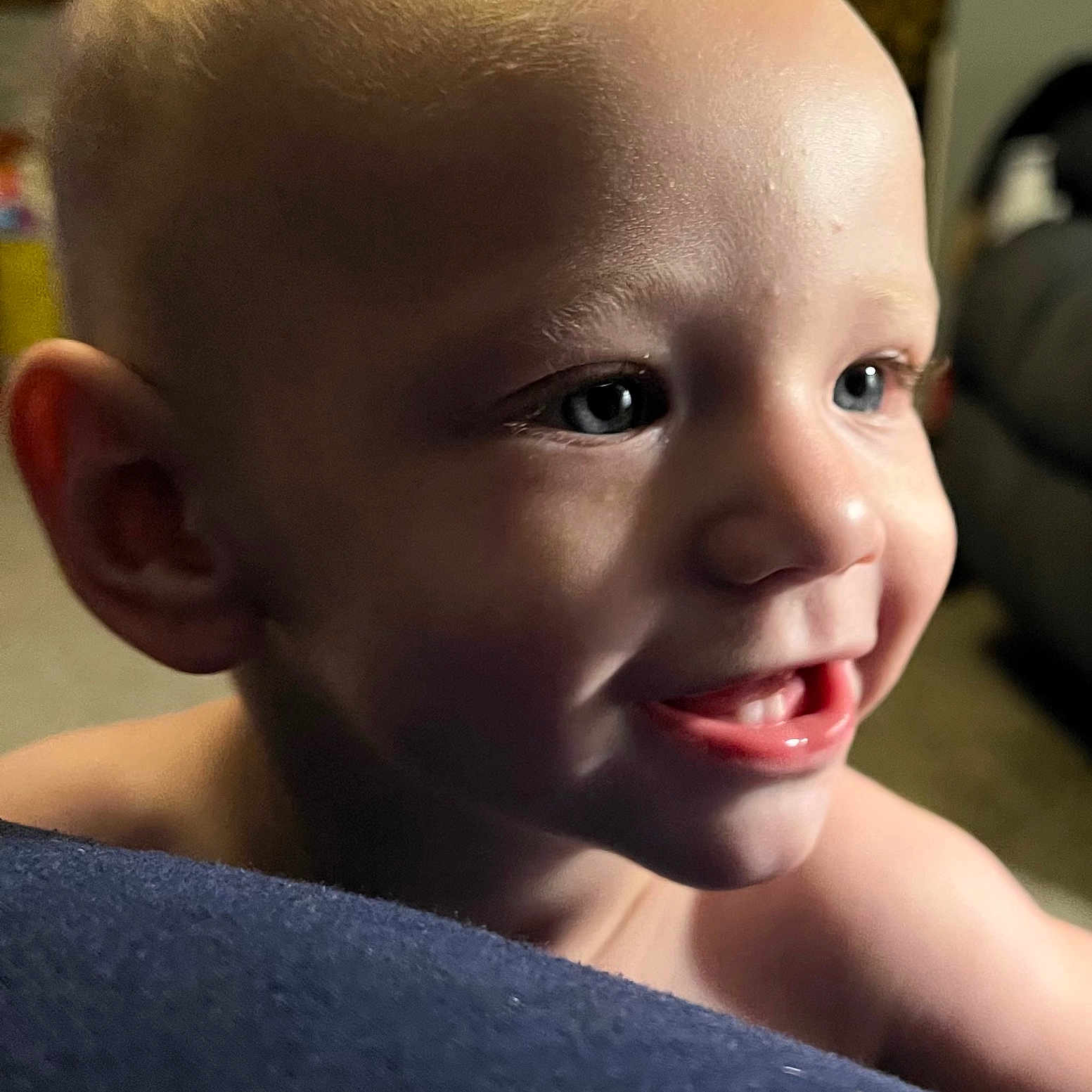 Remmington is registered to the contest to win money with this photo: baby, blue_eyes, cheek, child, close_up, ear, expression, face, happy, human, indoor, mouth, nose, person, portrait, shoulder, skin, smile, teeth, toddler