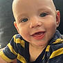 baby, child, smile, face, portrait, close_up, happy, cute, striped_shirt, navy, yellow, infant, person, skin, eyes, mouth, expression, young, head, indoors