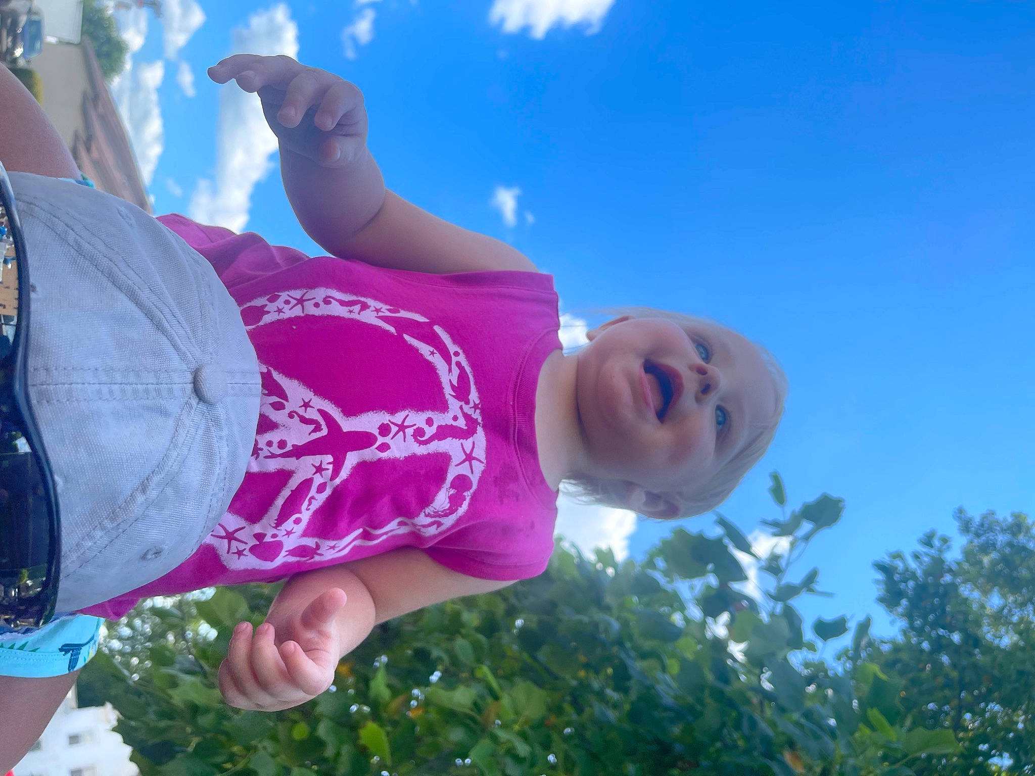 Cecilia is registered to the contest to win money with this photo: child, cloud, electric_blue, fun, grass, grassland, happy, hat, leaf, leisure, magenta, people_in_nature, person, plant, recreation, sky, smile, toddler, travel, tree