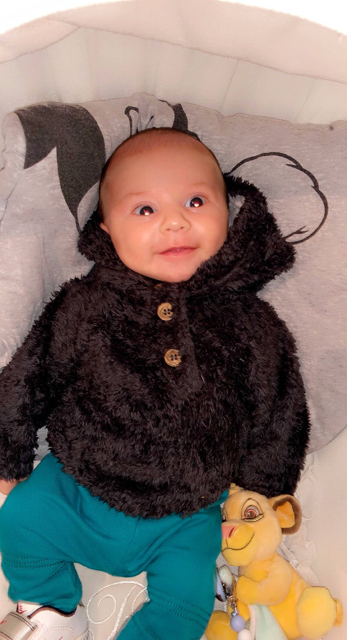 Kelyan participe au concours pour gagner de l'argent avec cette photo : baby, baby_toddler_clothing, cheek, child, doll, fur, happy, iris, lip, nose, organ, outerwear, pattern, person, skin, sleeve, textile, toddler, toy, wool