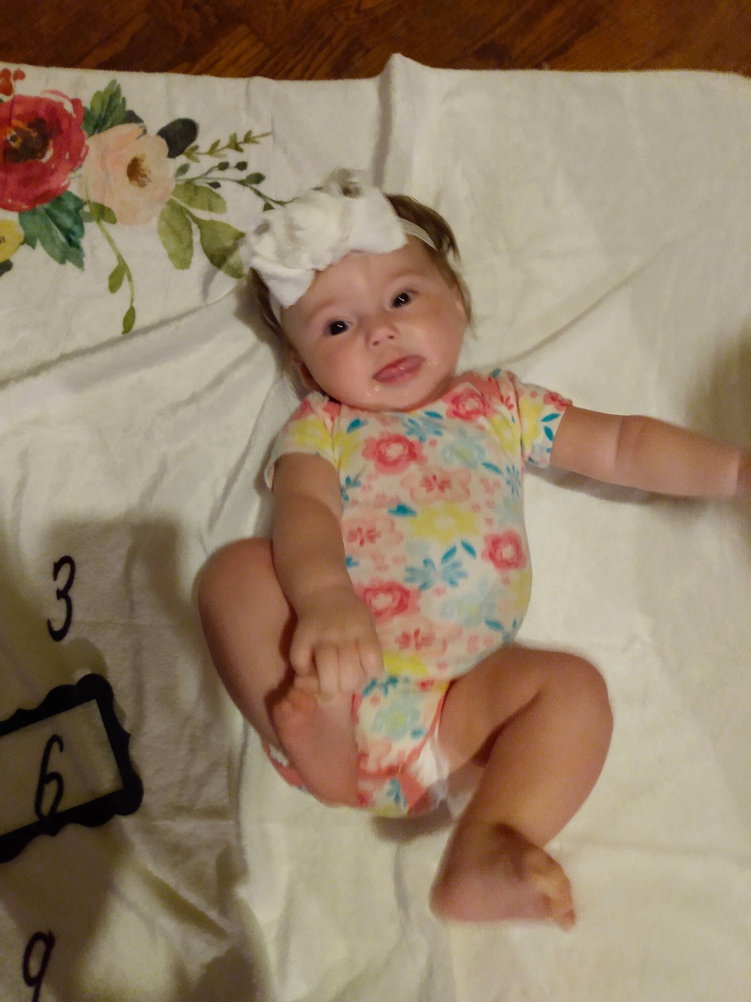 Brielle joined the competition — help win amazing prizes! baby, baby_toddler_clothing, cheek, child, comfort, dress, finger, foot, happy, head, headgear, headwear, linens, pattern, person, pink, room, skin, sleeve, smile