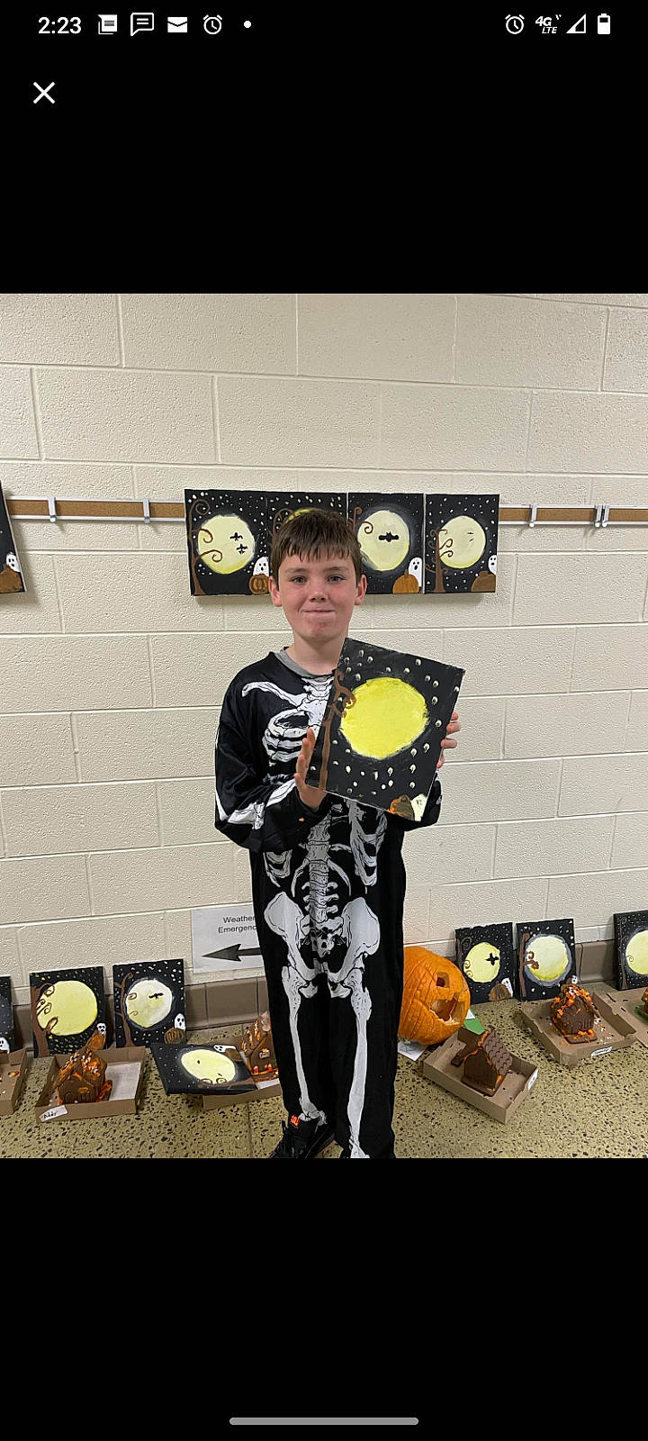 Tristan is registered to the contest to win money with this photo: art, costume, drum, event, fashion_design, formal_wear, hat, joy, membranophone, music, musical_instrument, musician, person, personal_protective_equipment, plucked_string_instruments, room