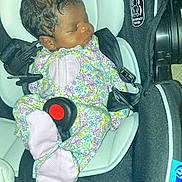 Rere joined the competition — help win amazing prizes! baby, newborn, car_seat, sleeping, infant, floral_onesie, pink, stripes, curly_hair, child, seatbelt, safety, black, white, fabric, cute, peaceful, resting, indoors, portrait