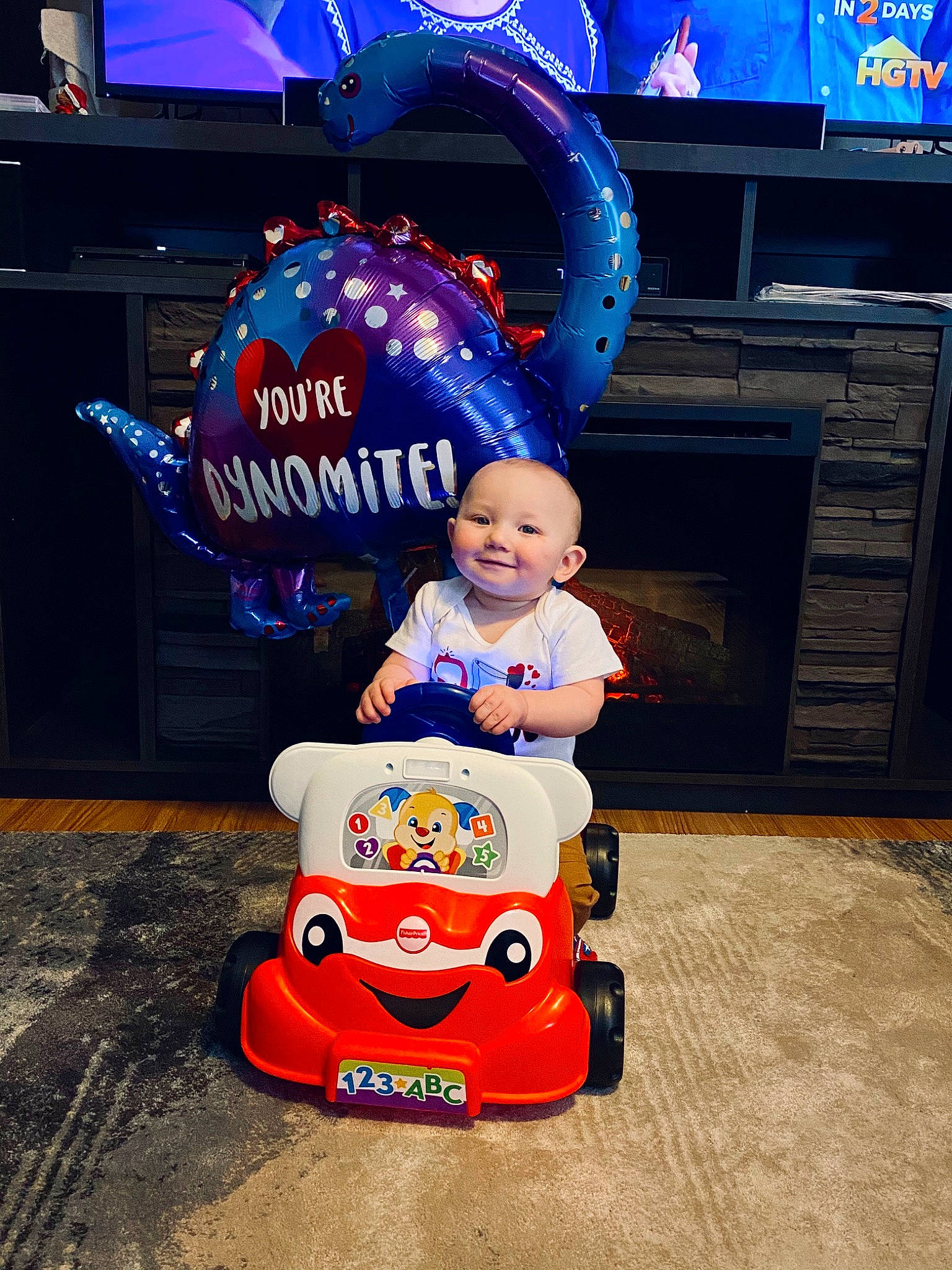 Tyler is registered to the contest to win money with this photo: child, games, joy, person, product, toddler, toy, vehicle