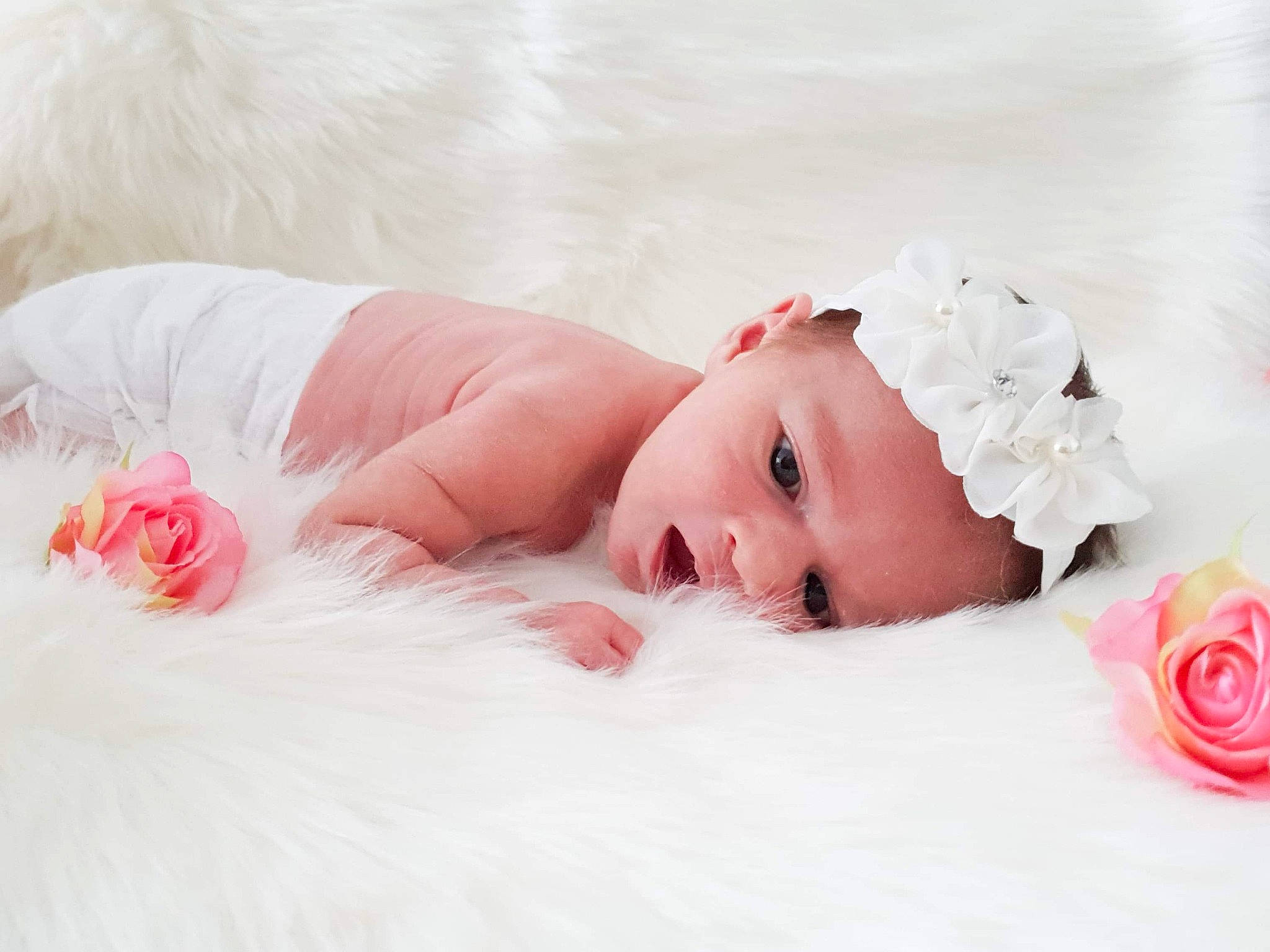Chiara participe au concours pour gagner de l'argent avec cette photo : baby, baby_toddler_clothing, cap, child, comfort, dress, eyelash, flooring, flower, headband, headpiece, linens, lip, pattern, person, petal, pink, rose, skin, textile