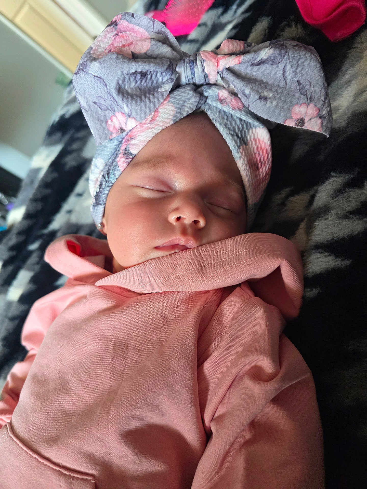 Emmeline joined the competition — help win amazing prizes! baby, sleeping, headband, bow, pink_hoodie, blanket, soft, face, peaceful, child, indoors, portrait, cozy, cute, rest, newborn, apparel, fashion, infant, closeup