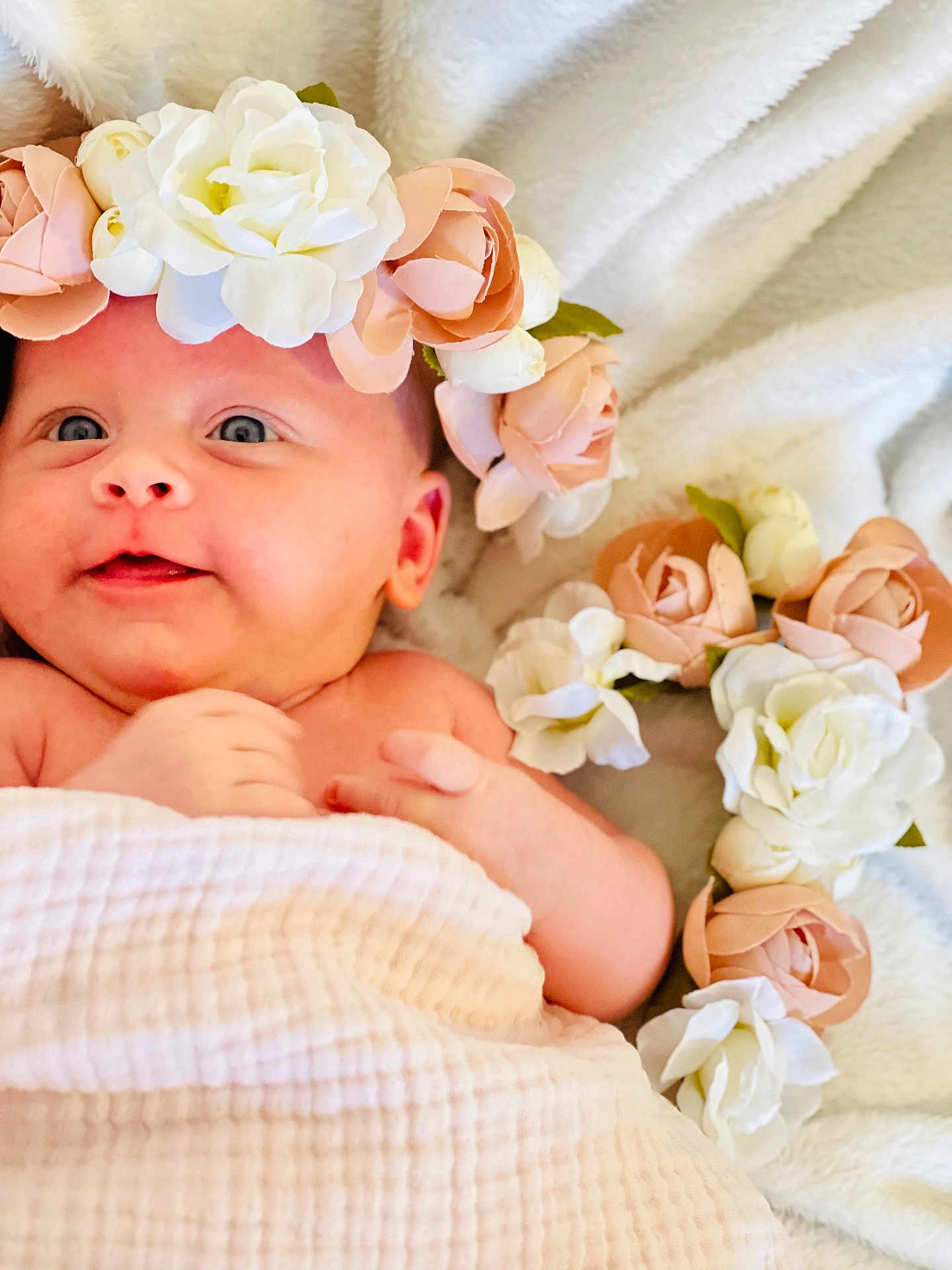 Melissa joined the competition — help win amazing prizes! baby, flower_crown, blanket, infant, soft_texture, pink_flowers, white_flowers, cute, portrait, closeup, laying_down, skin, newborn, head, cheeks, hand, happy, innocent, indoor, cozy