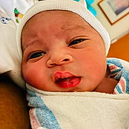 Amirr is registered to the contest to win money with this photo: newborn, baby, infant, swaddled, blanket, hat, face, closeup, skin, sleepy, cute, portrait, indoors, person, child, newborn_baby, headwear, expression, wrapped, soft
