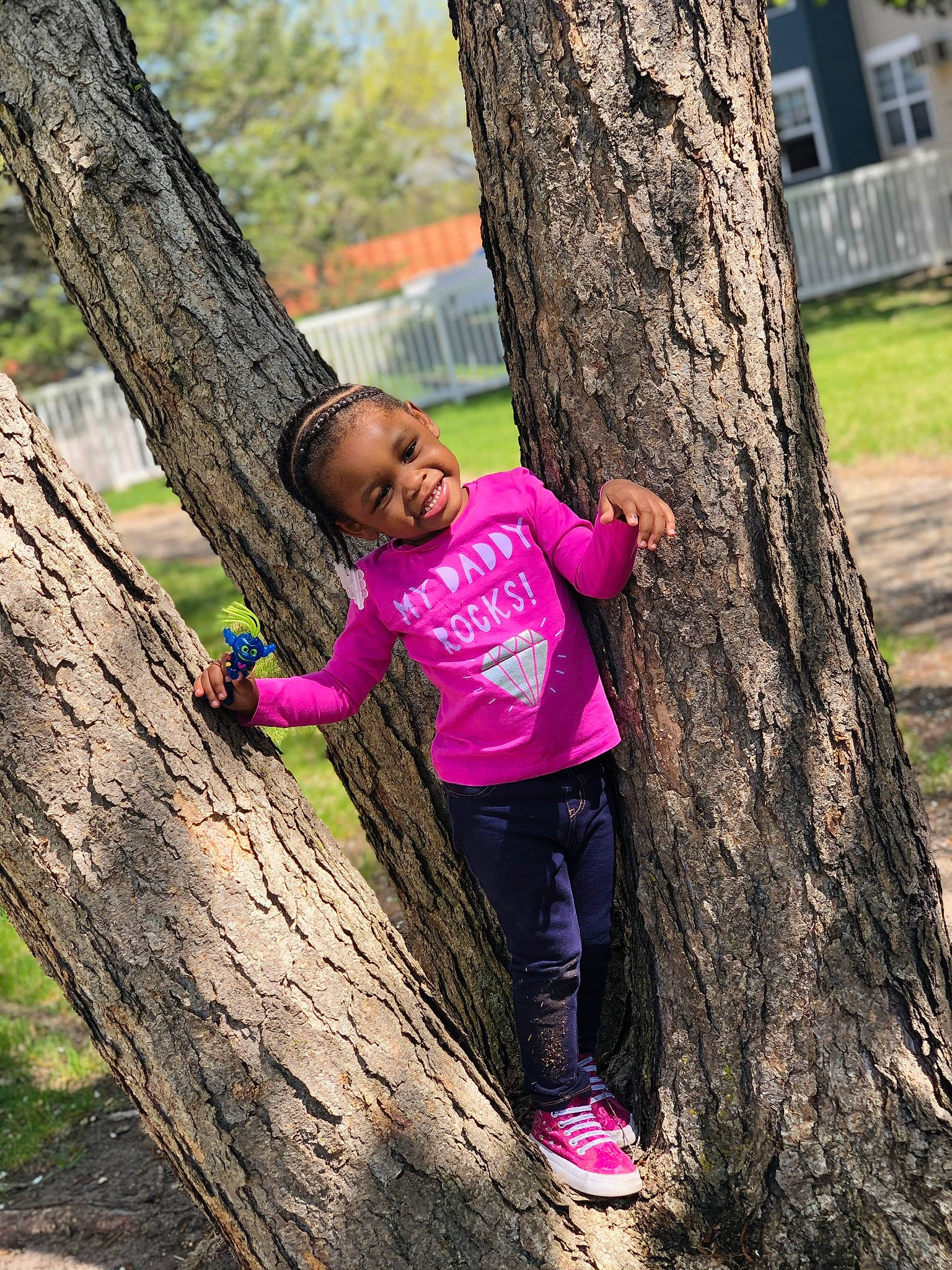 Ximena is registered to the contest to win money with this photo: beauty, branch, child, fun, grass, happy, hide_and_seek, joy, leisure, people_in_nature, person, photography, pink, plant, play, smile, spring, toddler, tree, trunk