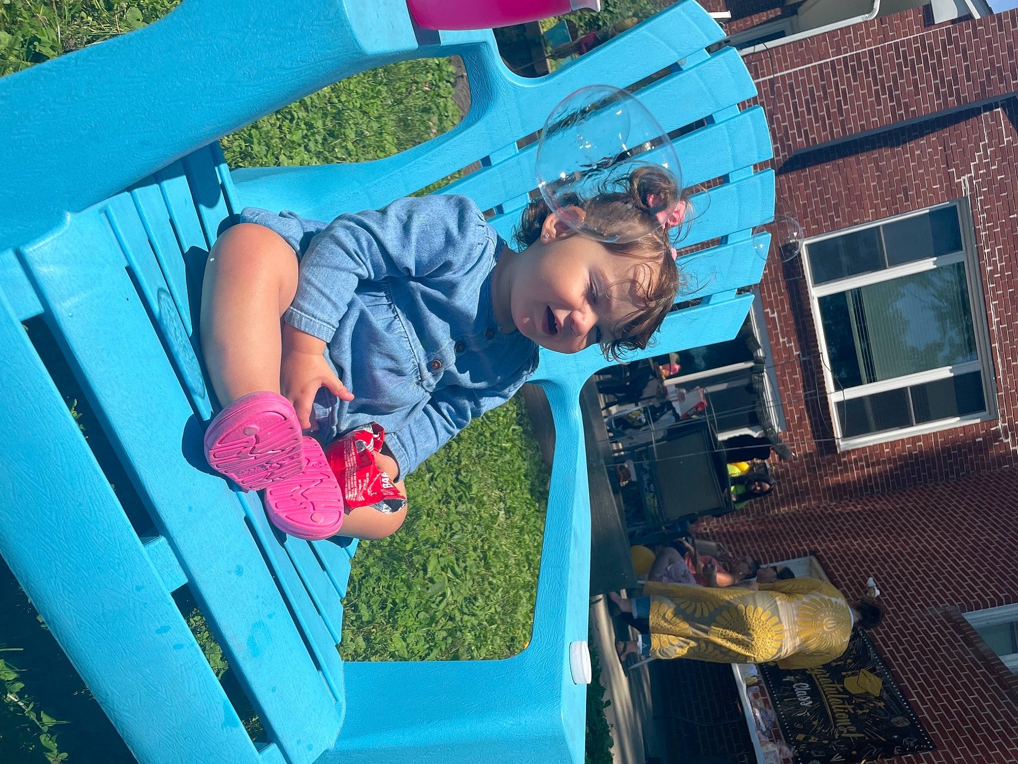 Quinn joined the competition — help win amazing prizes! auto_part, automotive_exterior, automotive_lighting, bumper, electric_blue, fun, grass, green, hood, house, leisure, motor_vehicle, person, pink, recreation, t_shirt, toddler, trunk, vehicle_door, window