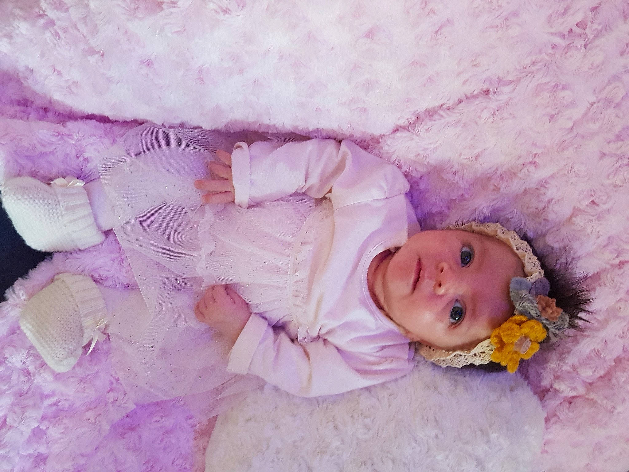 Nina participe au concours pour gagner de l'argent avec cette photo : baby, baby_products, baby_sleeping, baby_toddler_clothing, child, comfort, eye, fur, head, headgear, headwear, iris, linens, magenta, person, pink, purple, skin, sleeve, textile