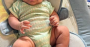 Liam is registered to the contest to win money with this photo: baby, infant, smiling, onesie, socks, baby_seat, mesh_fabric, blue, white, cute, chubby, hand, footwear, indoors, portrait, child, person, seat, comfort, happy