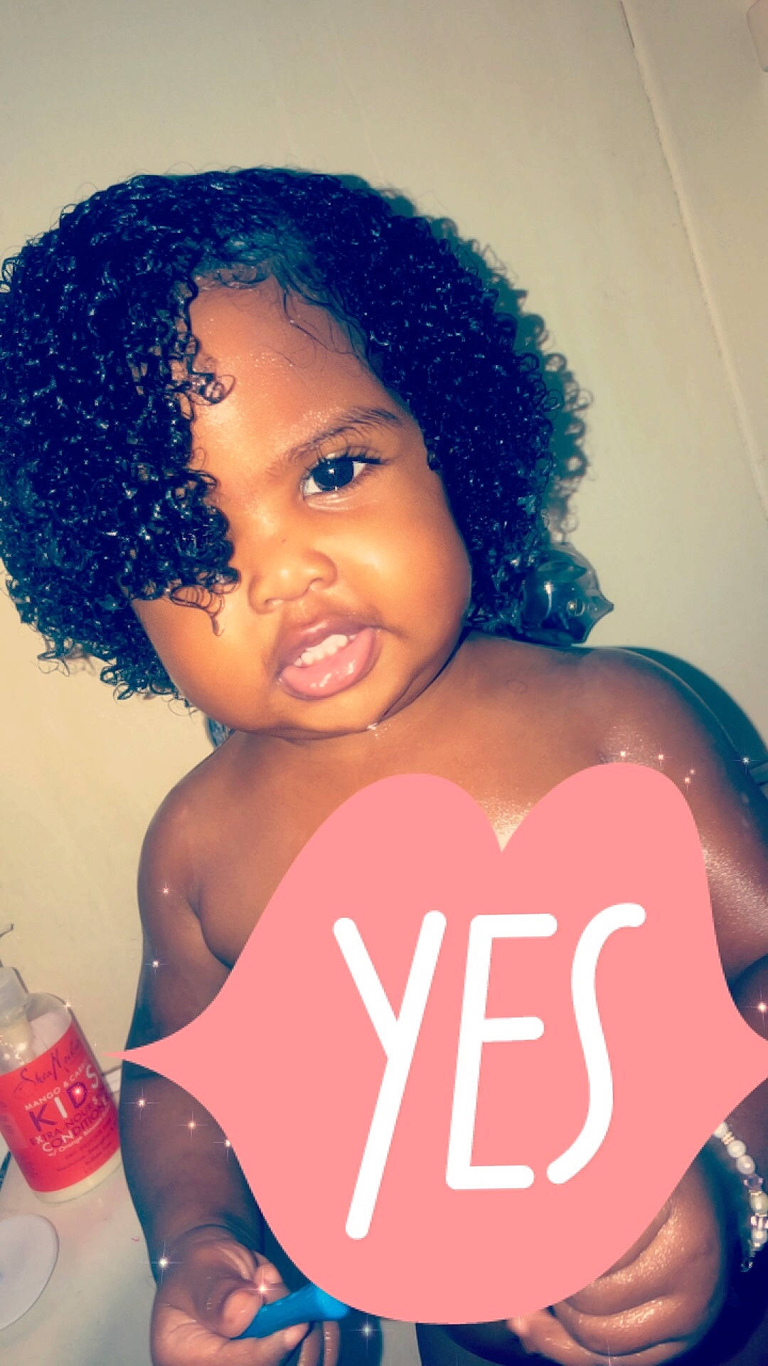 Kassie is registered to the contest to win money with this photo: afro, black_hair, blue, cheek, child, cool, eyebrow, forehead, fun, girl, hair, hair_coloring, hairstyle, head, human, human_hair_color, jheri_curl, lip, person, product