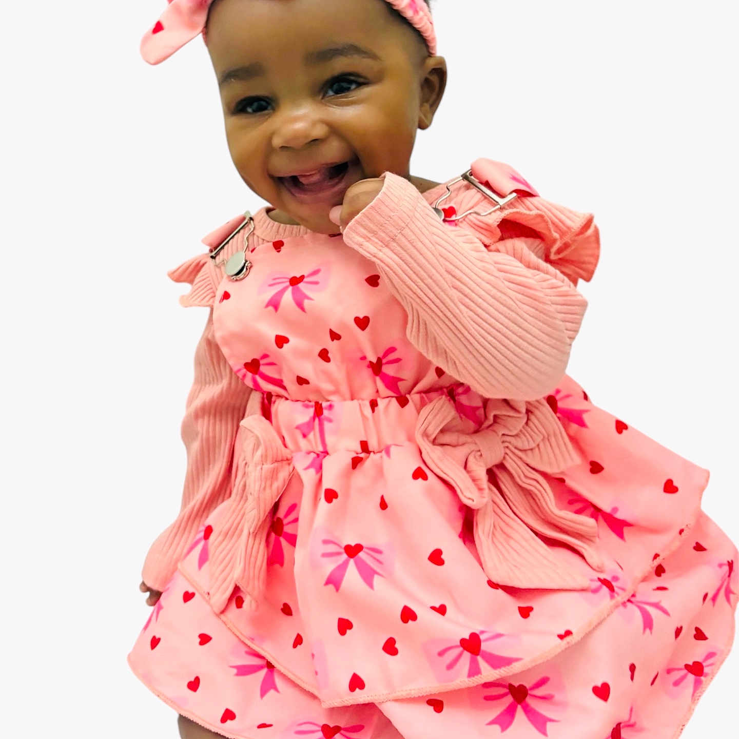Khwezi joined the competition — help win amazing prizes! accessory, baby, bare_feet, bow, cheerful, child, closeup, dark_hair, eyes, happy, headband, heart_pattern, knitted_sleeves, long_sleeves, pink_dress, portrait, sitting, smile, studio_background, toes