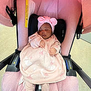 Khwezi is registered to the contest to win money with this photo: baby, infant, sleeping, pink, stroller, headband, child, cute, cozy, clothing, infantwear, portrait, seat, resting, peaceful, babywear, soft, comfort, newborn, toddler