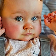 Indigo is registered to the contest to win money with this photo: baby, child, face, blue_eyes, rosy_cheeks, close_up, curious_expression, soft_texture, clothing, suspenders, person, portrait, indoor, infant, cute, young_child, skin, head, eyelashes, nose