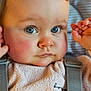 baby, blue_eyes, child, close_up, clothing, curious_expression, cute, eyelashes, face, head, indoor, infant, nose, person, portrait, rosy_cheeks, skin, soft_texture, suspenders, young_child
