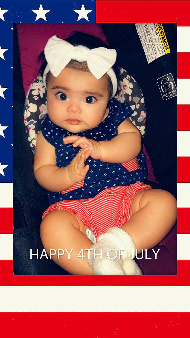 Esmeralda is registered to the contest to win money with this photo: baby, baby_toddler_clothing, cap, child, child_model, font, headgear, headwear, pattern, person, photo_caption, photography, product, toddler