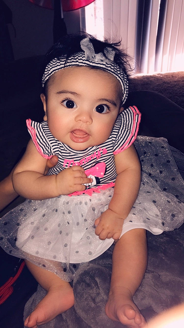 Esmeralda joined the competition — help win amazing prizes! baby, baby_toddler_clothing, beauty, cheek, child, child_model, eye, fashion_accessory, hair_accessory, head, headband, headgear, headwear, iris, lip, nose, person, pink, sitting, skin