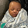 baby, sleeping, blanket, pacifier, cozy, infant, wrapped, peaceful, soft, comfort, child, face, closed_eyes, cute, resting, indoor, portrait, warm, snug, toddler