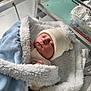 newborn, baby, blanket, hat, sleeping, hospital, bassinet, infant, cute, cozy, soft, knit_hat, child, wrapped, resting, peaceful, indoors, person, bed, warm