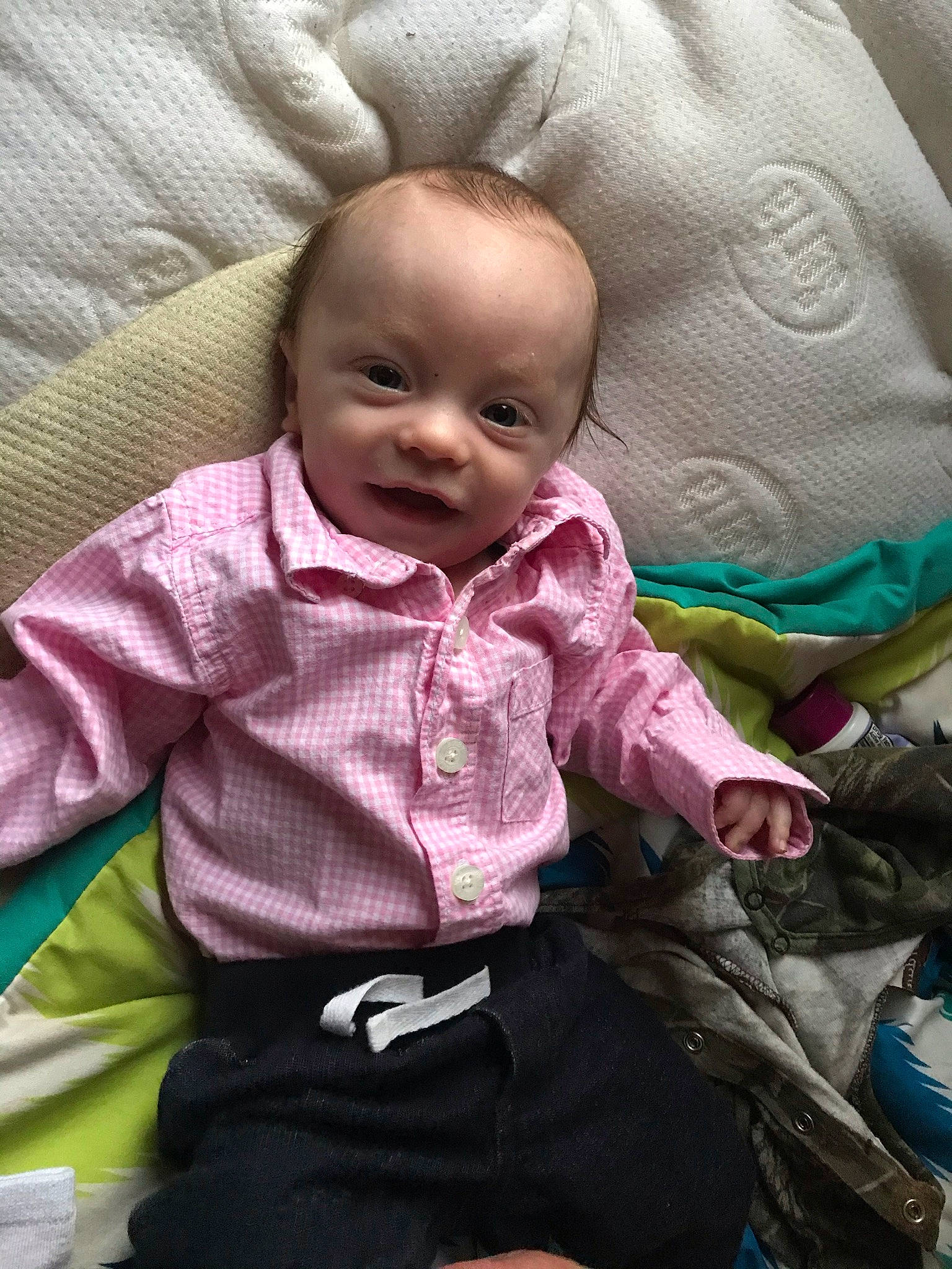 Oaklee is registered to the contest to win money with this photo: baby, baby_carriage, baby_products, baby_toddler_clothing, cheek, child, comfort, facial_expression, happy, lap, linens, mouth, people, person, pink, product, skin, sleeve, smile, toddler