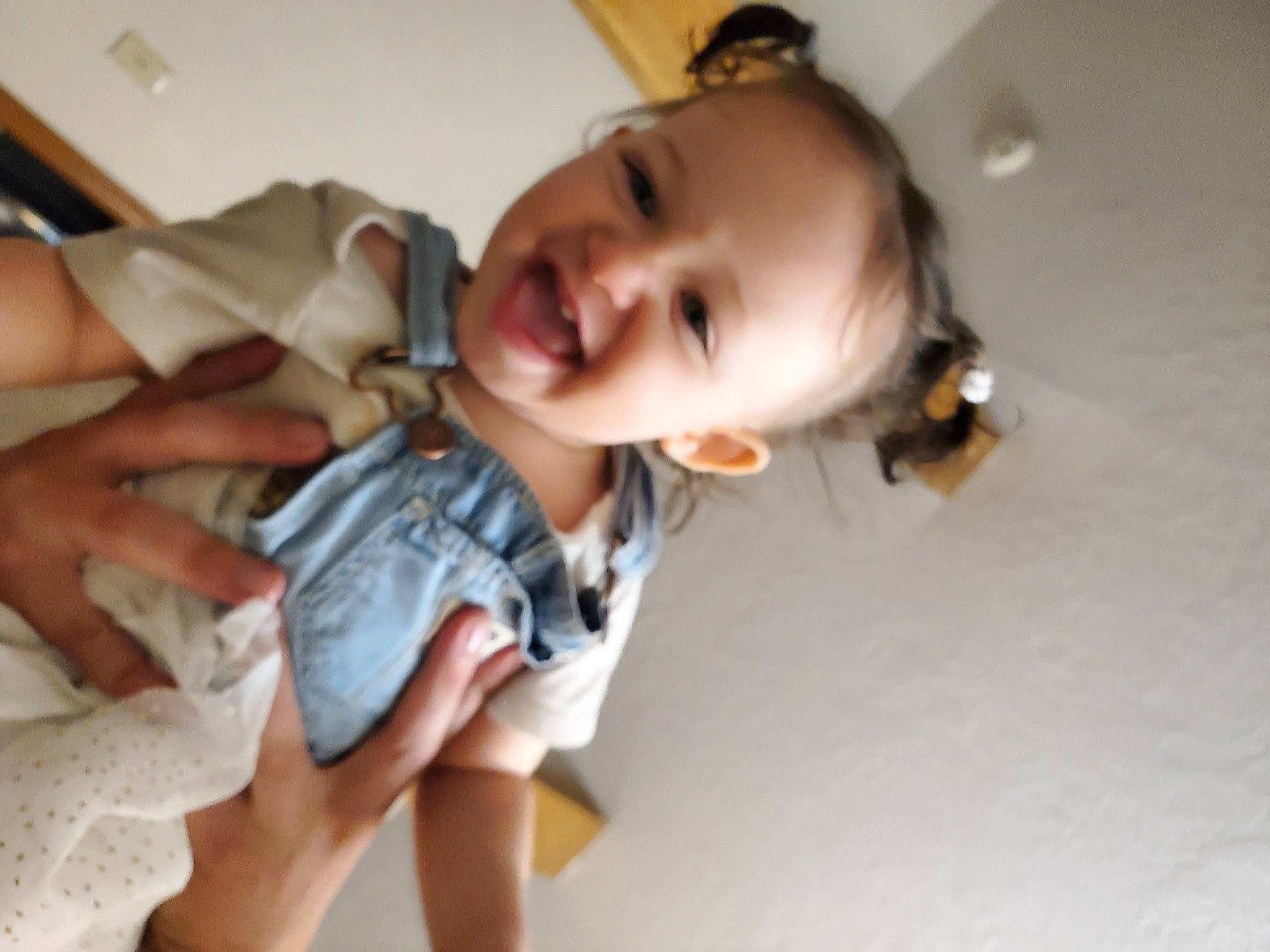 Emberlynn is registered to the contest to win money with this photo: baby, baby_toddler_clothing, cheek, child, comfort, eye, flooring, fun, happy, mammal, mouth, nose, person, sitting, skin, sleeve, smile, thigh, thumb, toddler