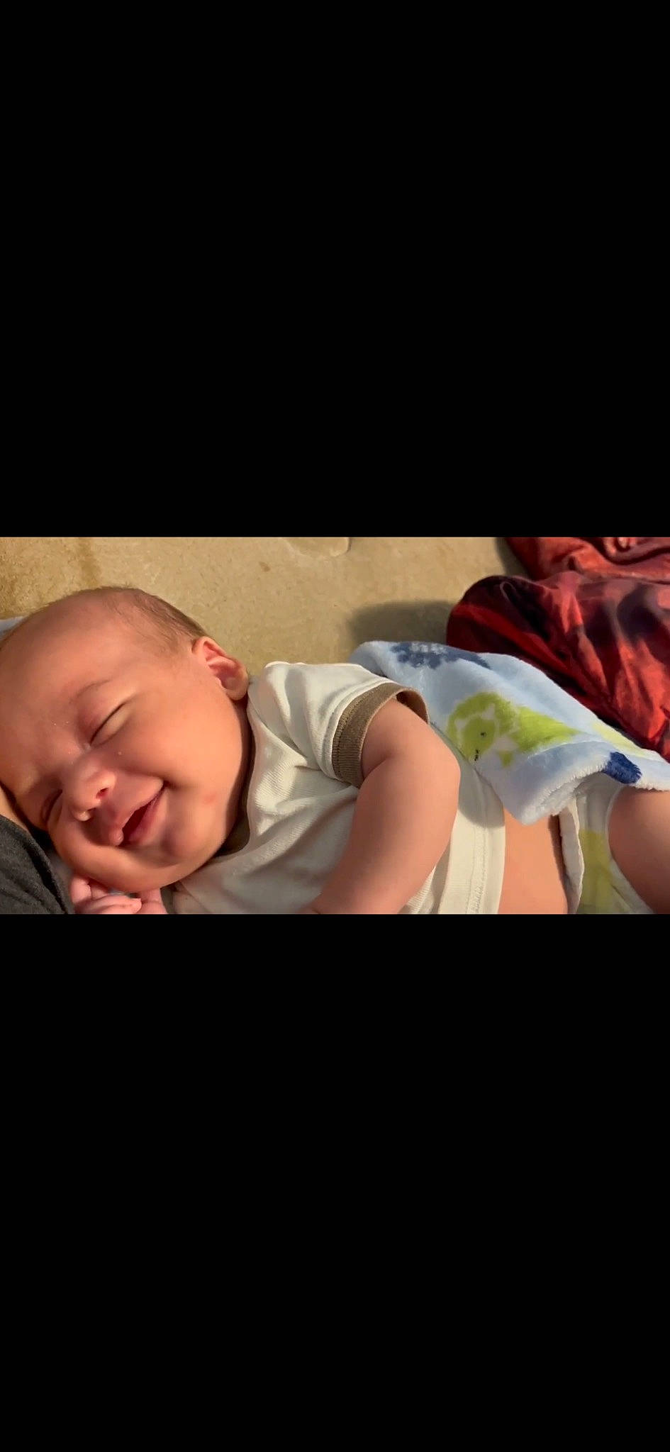 Jaxtyn is registered to the contest to win money with this photo: baby, baby_toddler_clothing, cheek, child, comfort, darkness, elbow, flash_photography, flesh, happy, linens, person, portrait_photography, room, sitting, sleep, sleeve, smile, t_shirt, toddler