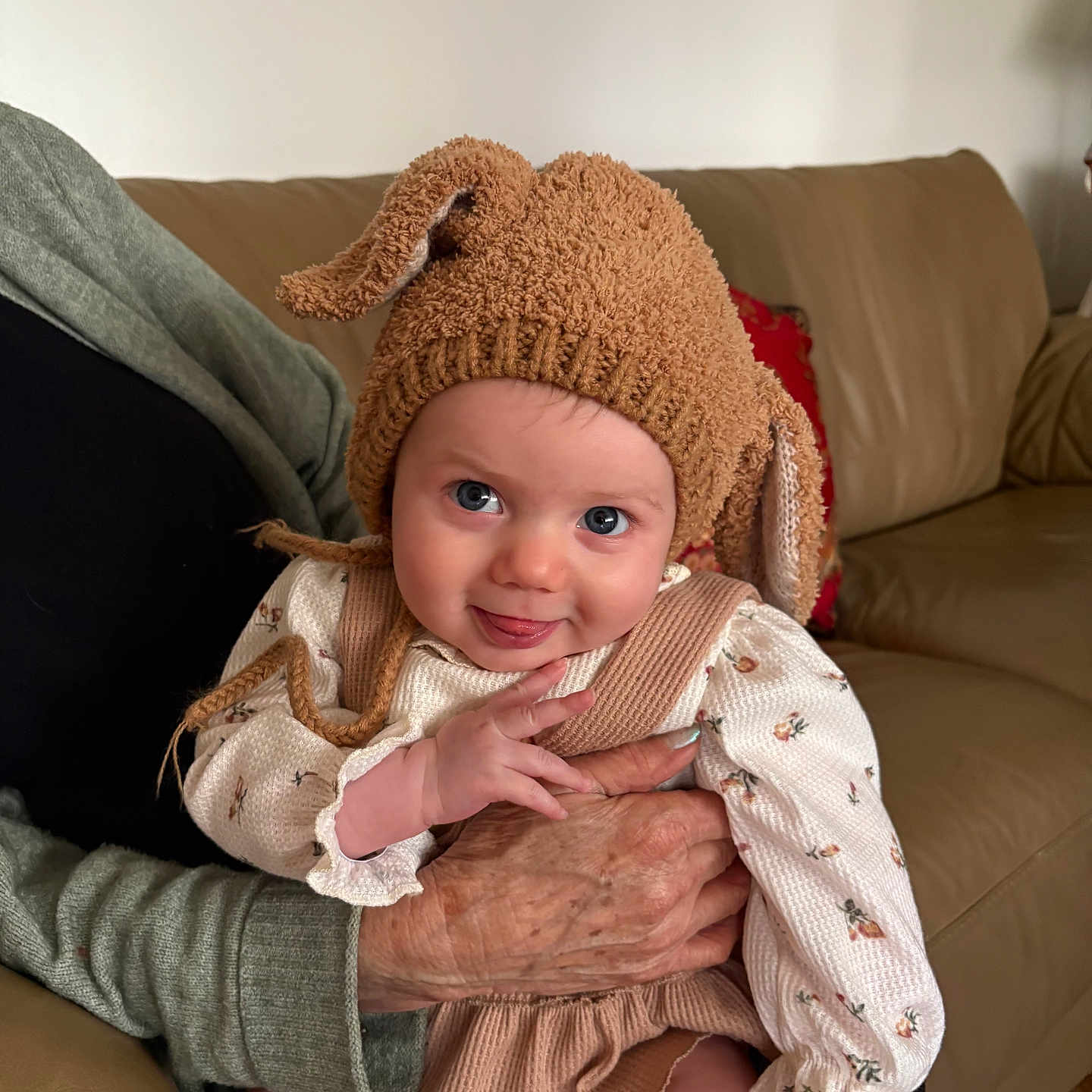 Eleni joined the competition — help win amazing prizes! architecture, baby, beanie, bodypart, bonnet, building, cap, clothing, couch, face, finger, furniture, hand, happy, hat, head, person, photography, portrait, smile