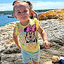 boat, child, coast, doll, girl, minnie_mouse, nature, outdoor, pigtails, play, purple_shoes, rock, scenic, smile, summer, sunny, toddler, vacation, water, yellow_shirt
