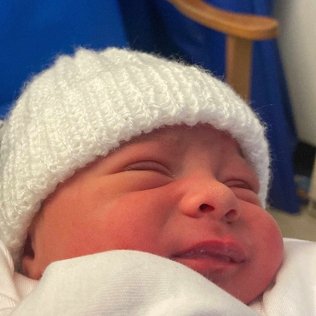 Albion joined the competition — help win amazing prizes! architecture, baby, beanie, bodypart, bonnet, building, cap, clothing, face, finger, glove, hand, hat, head, hospital, newborn, person, photography, portrait, sleeping