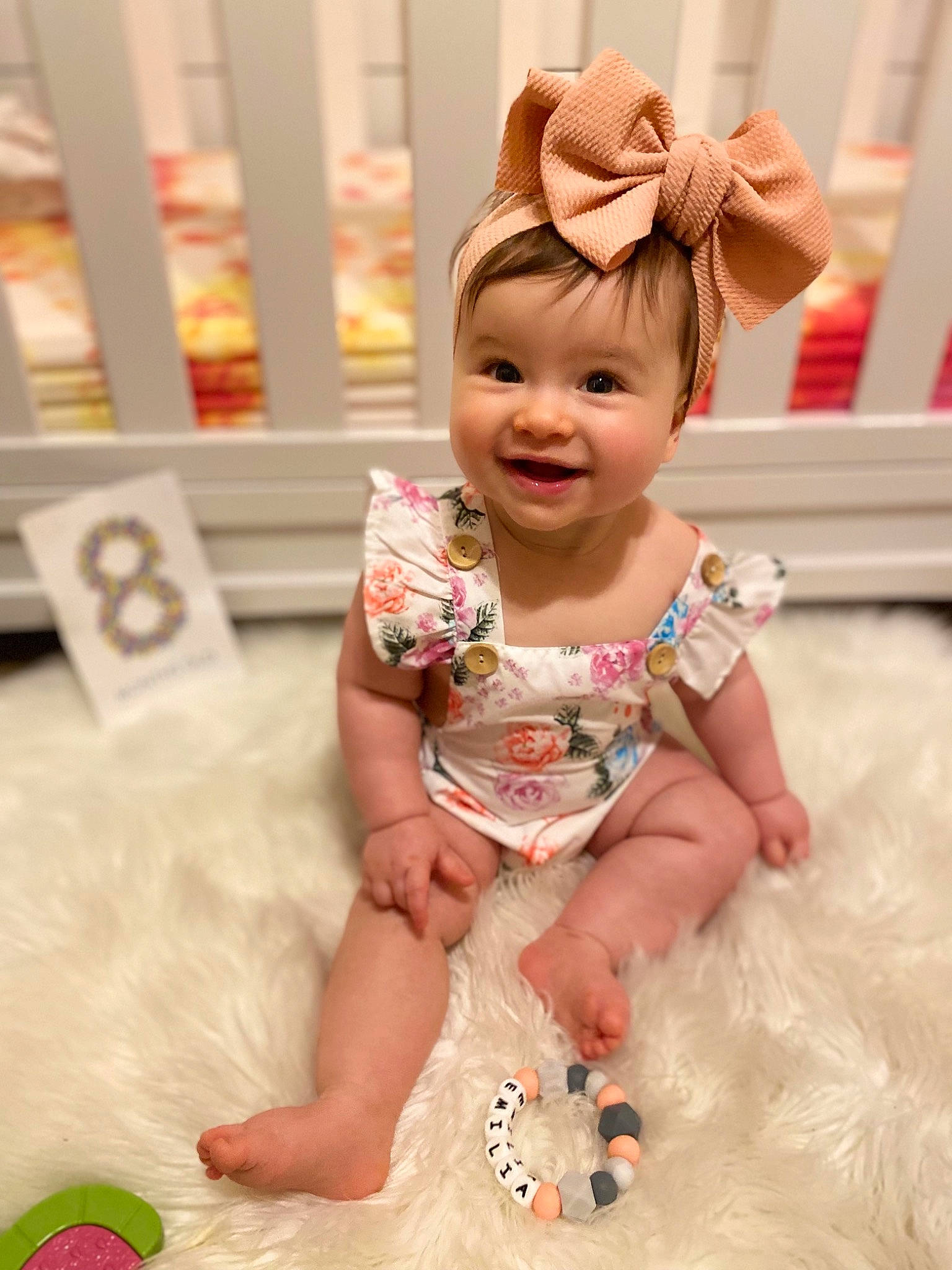 Emilia is registered to the contest to win money with this photo: baby, baby_toddler_clothing, cheek, child, eye, face, flooring, fun, happy, joy, pattern, peach, person, pink, product, red, room, skin, sleeve, smile