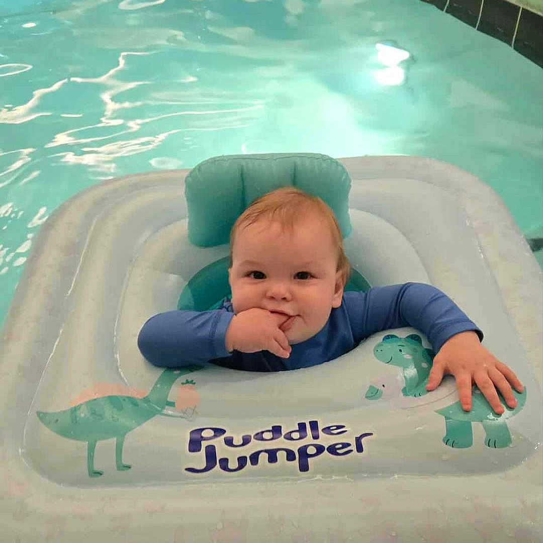 Simon is registered to the contest to win money with this photo: baby, blue, child, cute, float, fun, happy, indoor_pool, infant, playful, pool, puddle_jumper, safety, sitting, smiling, splash, summer, swimming, water, water_toy
