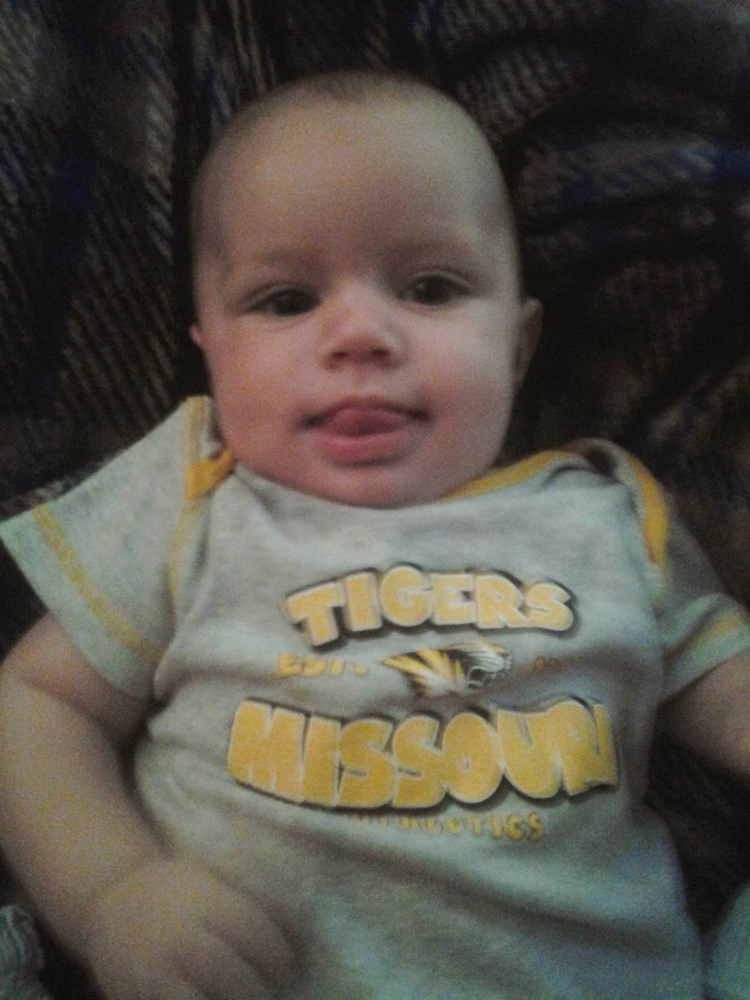 Jessie is registered to the contest to win money with this photo: baby, baby_toddler_clothing, cheek, chin, comfort, cool, eyebrow, forehead, happy, human, human_body, iris, lip, mouth, nose, person, skin, sleeve, smile, t_shirt