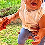 baby, child, smiling, bandana, white_clothing, blue_pants, barefoot, outdoor, grass, hand_holding, happy, person, nature, greenery, portrait, infant, daylight, cute, baby_fashion, playful