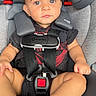 baby, black_clothing, car_safety, car_seat, child, cute, expression, hands, indoor, infant, legs, looking_at_camera, maxi_cosi, portrait, red_detail, safety, seatbelt, socks, straps, young_child