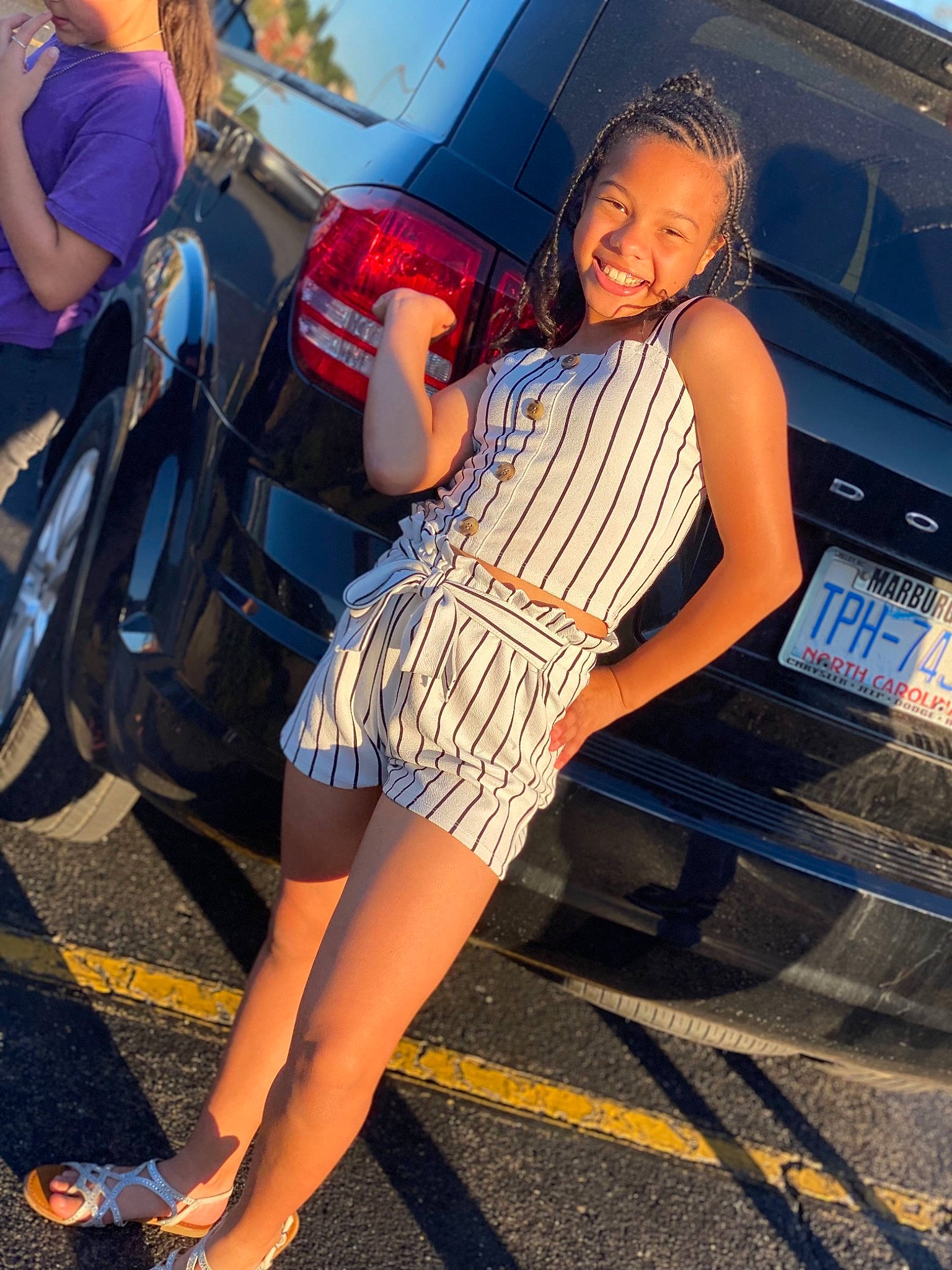 Aaliyah is registered to the contest to win money with this photo: automotive_design, automotive_exterior, automotive_lighting, automotive_tire, blue, bumper, car, eyewear, fashion, flash_photography, hood, joy, leg, leisure, motor_vehicle, person, shoe, sneakers, street_fashion, thigh
