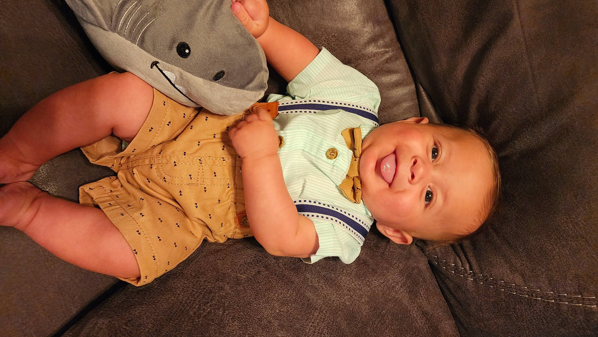 George is registered to the contest to win money with this photo: baby, baby_toddler_clothing, baseball_cap, cap, cheek, child, comfort, eye, fedora, foot, hat, headgear, leg, mammal, pattern, person, skin, sleeve, sun_hat, toddler