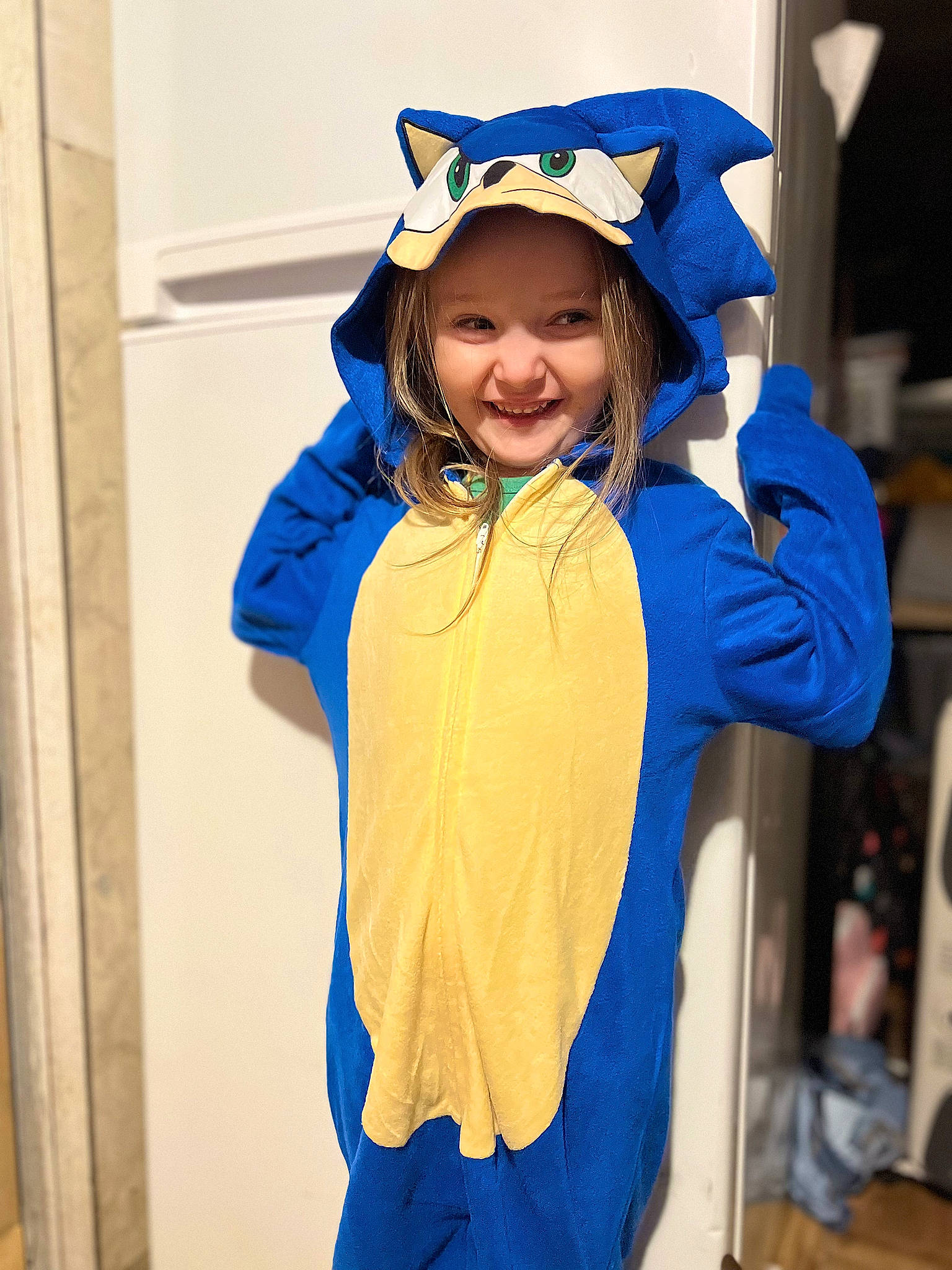 Luna is registered to the contest to win money with this photo: blue, costume, electric_blue, event, fashion_accessory, fashion_design, fun, gesture, glove, happy, headgear, headwear, joy, mortarboard, person, personal_protective_equipment, room, sleeve, smile, toddler