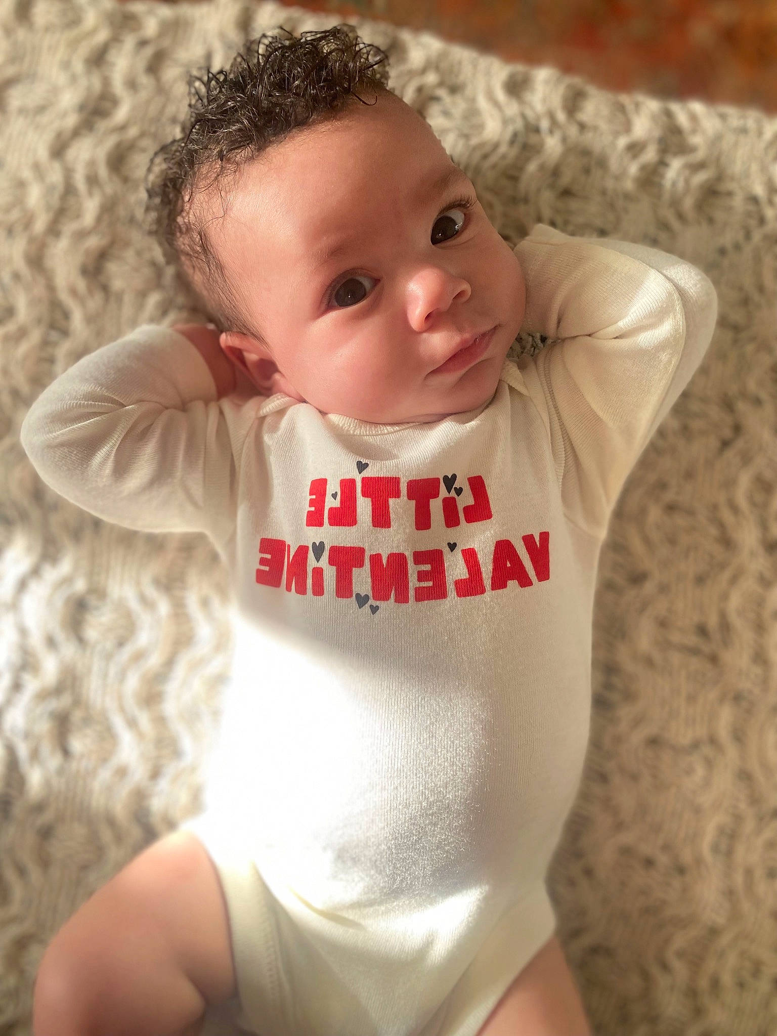 Theo is registered to the contest to win money with this photo: baby, baby_toddler_clothing, cheek, chest, chin, comfort, elbow, eye, face, gesture, happy, head, human_body, lip, neck, person, shoulder, skin, sleeve, thigh