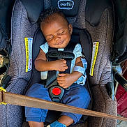 Auguste joined the competition — help win amazing prizes! baby, car_seat, sleeping, child, infant, blue_shoes, clothing, harness, safety, cute, peaceful, small_hand, casual_wear, indoors, comfort, resting, seatbelt, head_support, portrait, smile