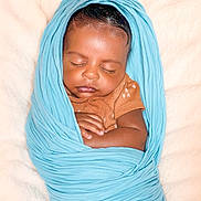 Auguste joined the competition — help win amazing prizes! baby, sleeping, swaddled, blanket, blue, infant, peaceful, cute, wrapped, soft, newborn, resting, child, skin, clothing, hand, portrait, closeup, indoors, comfort