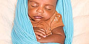 Auguste joined the competition — help win amazing prizes! baby, sleeping, swaddled, blanket, blue, infant, peaceful, cute, wrapped, soft, newborn, resting, child, skin, clothing, hand, portrait, closeup, indoors, comfort