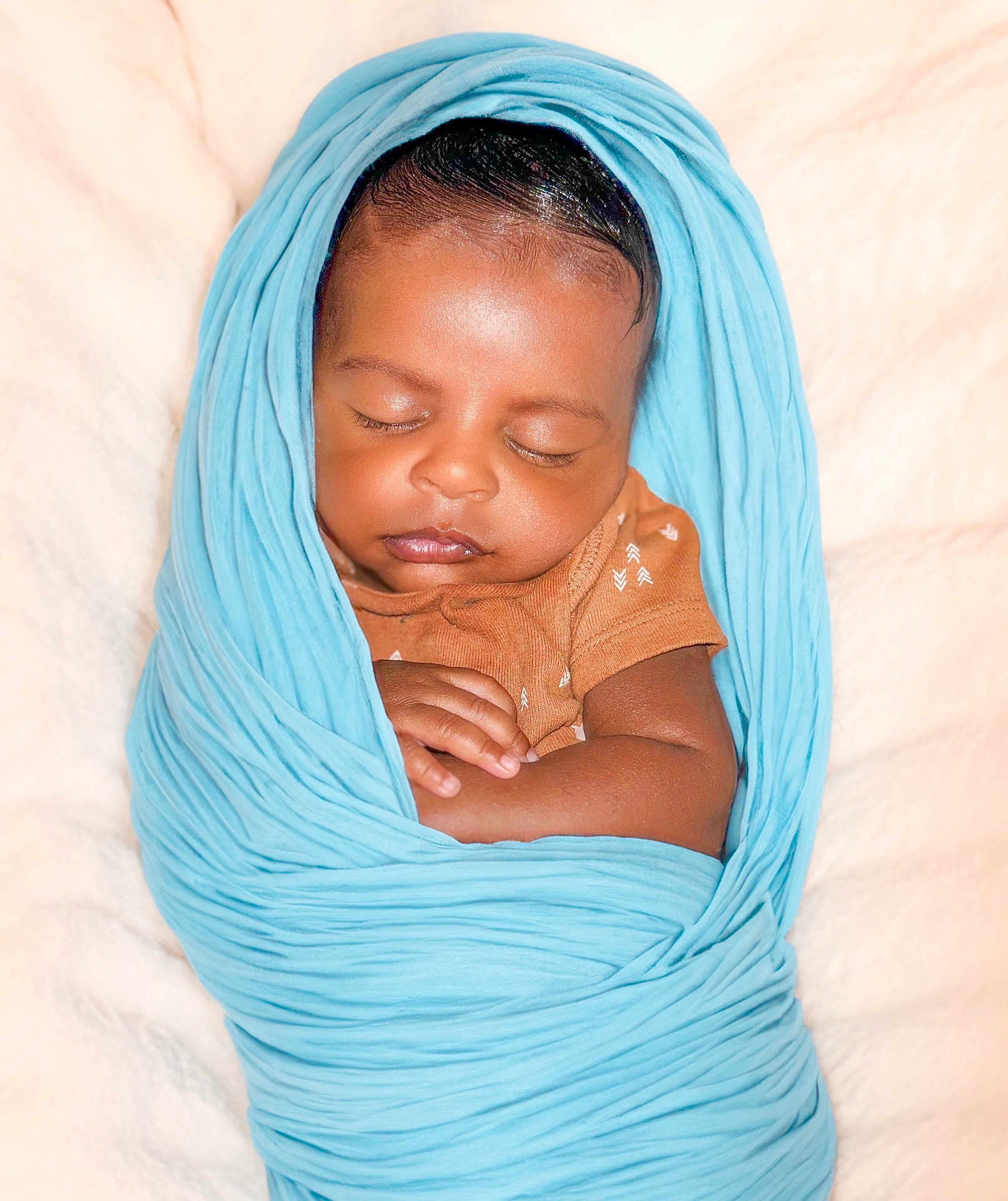 Auguste joined the competition — help win amazing prizes! baby, sleeping, swaddled, blanket, blue, infant, peaceful, cute, wrapped, soft, newborn, resting, child, skin, clothing, hand, portrait, closeup, indoors, comfort