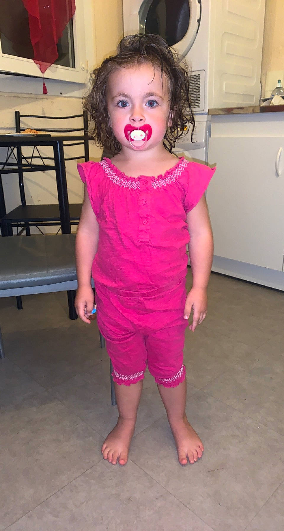 Ilana participe au concours pour gagner de l'argent avec cette photo : baby_toddler_clothing, cheek, dress, eye, eyelash, face, gesture, happy, head, iris, joint, leg, lip, one_piece_garment, person, pink, shoulder, skin, sleeve, toddler