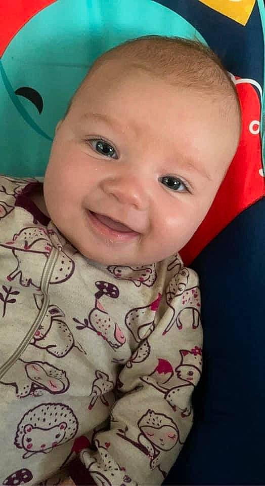 Maci is registered to the contest to win money with this photo: baby_toddler_clothing, cheek, chin, eye, eyebrow, facial_expression, forehead, hairstyle, head, human_body, iris, joy, lip, mouth, neck, nose, organ, person, skin, sleeve